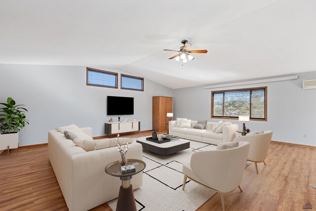 living room with light hardwood / wood-style flooring, ceiling fan, and lofted ceiling