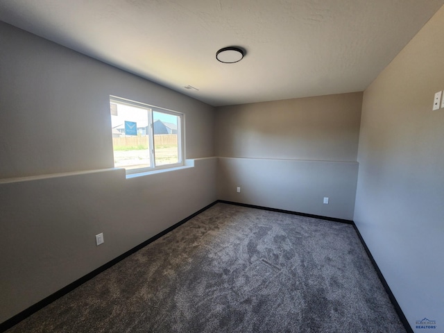 empty room featuring carpet floors