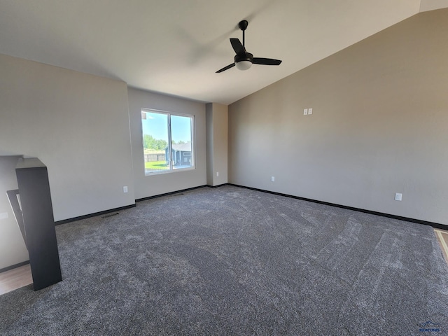 carpeted spare room featuring ceiling fan and lofted ceiling