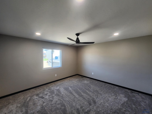 unfurnished room featuring carpet and ceiling fan