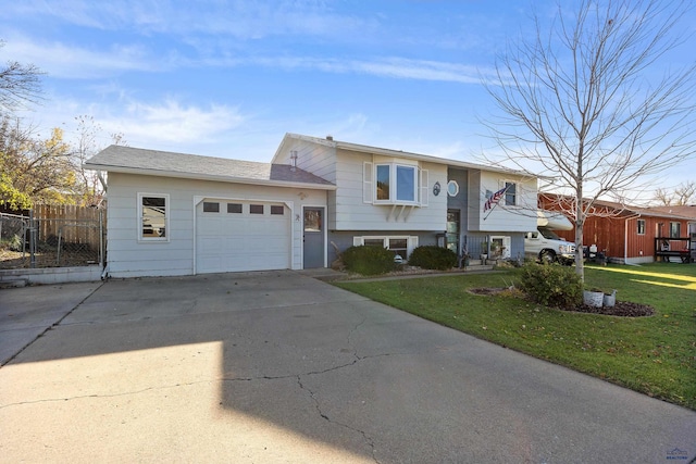 view of front facade featuring a front yard and a garage