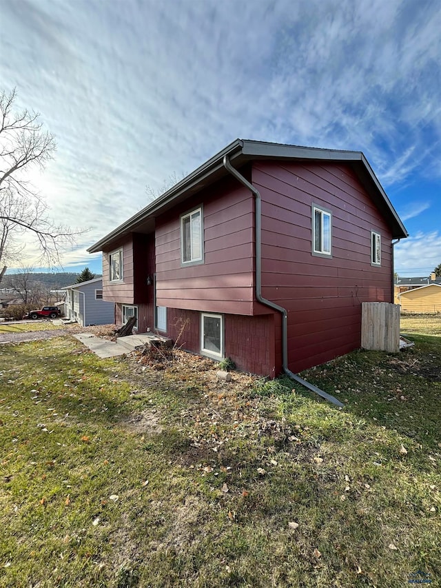 view of property exterior featuring a yard