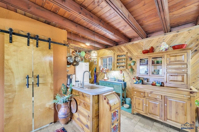 kitchen featuring beamed ceiling, wood ceiling, sink, and wooden walls