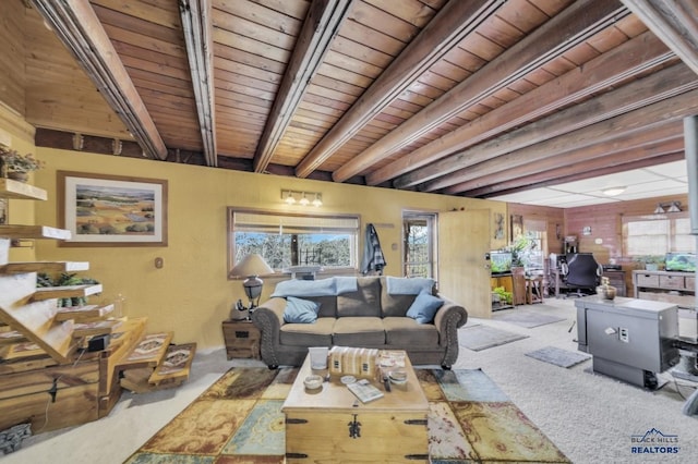 carpeted living room featuring beam ceiling and wooden ceiling