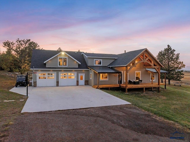 view of front facade with a garage and a lawn