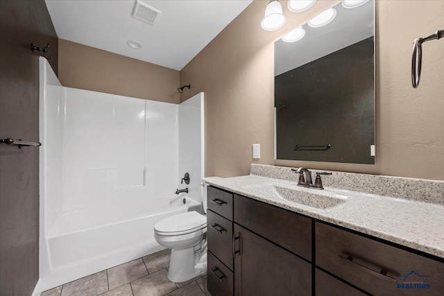 full bathroom with toilet, vanity, tile patterned flooring, and bathing tub / shower combination