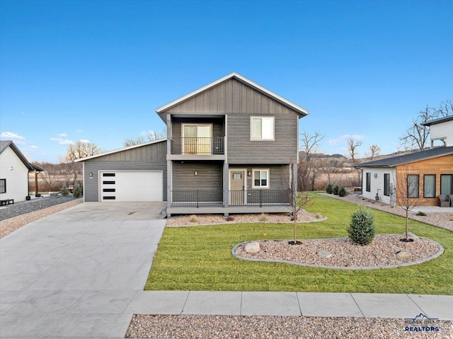 view of front of house with a balcony and a front lawn