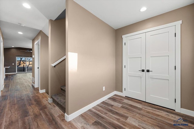 hall with dark wood-type flooring