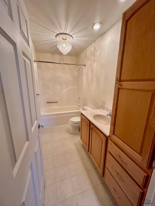 full bathroom with a chandelier, vanity, bathing tub / shower combination, and toilet