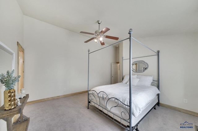 carpeted bedroom featuring ceiling fan and lofted ceiling