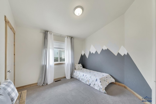 bedroom featuring light carpet