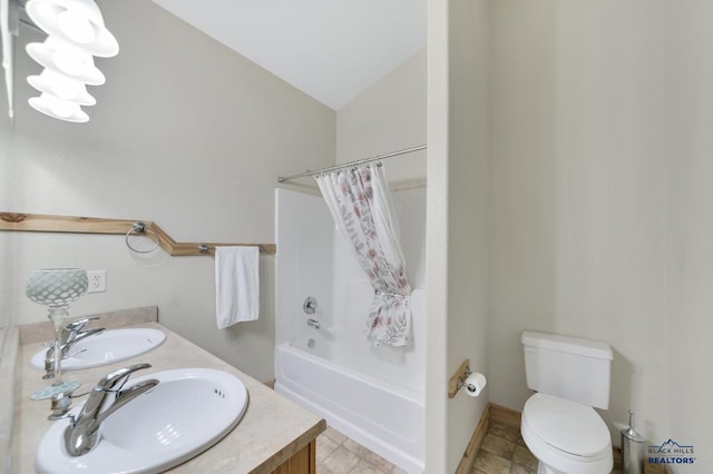 full bathroom featuring shower / bath combination with curtain, toilet, lofted ceiling, and vanity