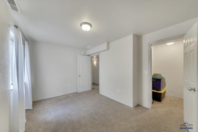 interior space featuring light colored carpet