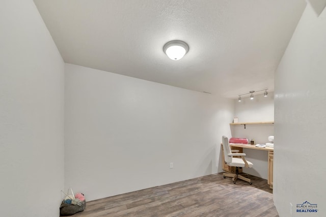 office area with hardwood / wood-style flooring and a textured ceiling