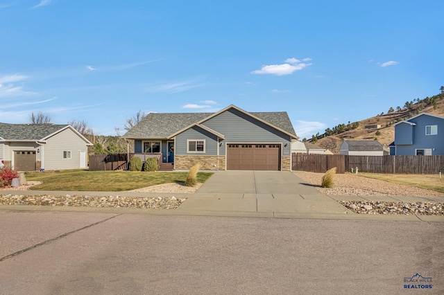 view of front of house with a garage and a front lawn