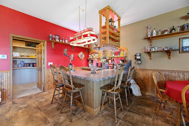 bar featuring wooden walls