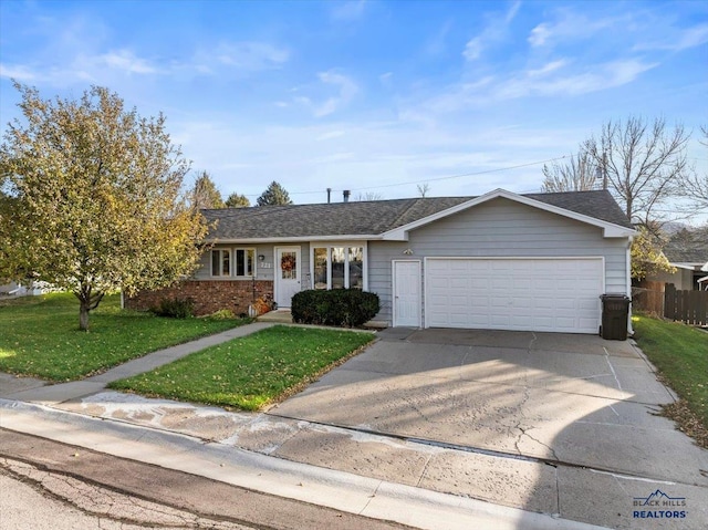 ranch-style house with a garage and a front lawn