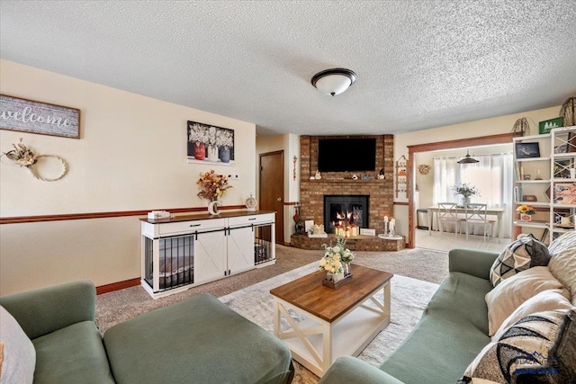 living room featuring a fireplace, light colored carpet, and a textured ceiling