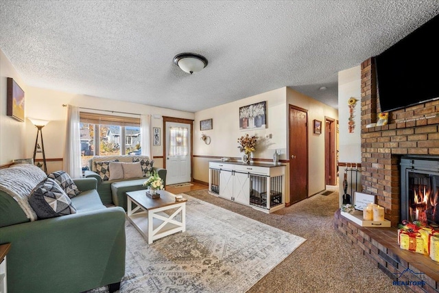 carpeted living room featuring a textured ceiling and a brick fireplace