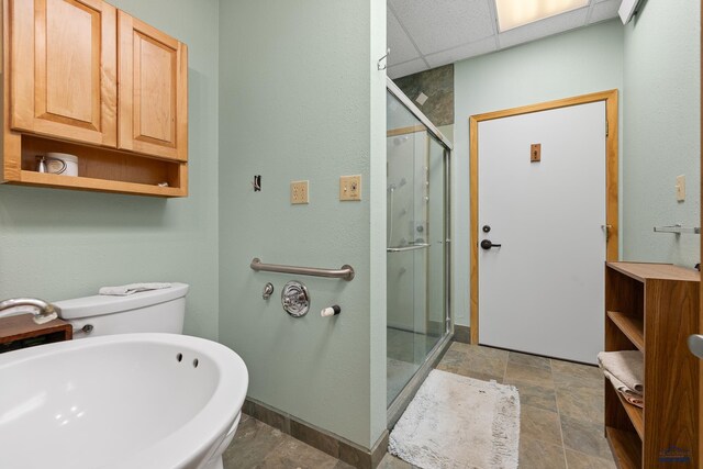 bathroom featuring a paneled ceiling, sink, and walk in shower