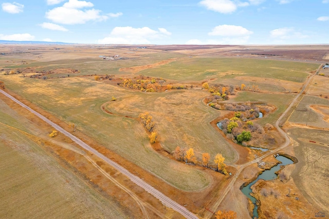 birds eye view of property featuring a rural view