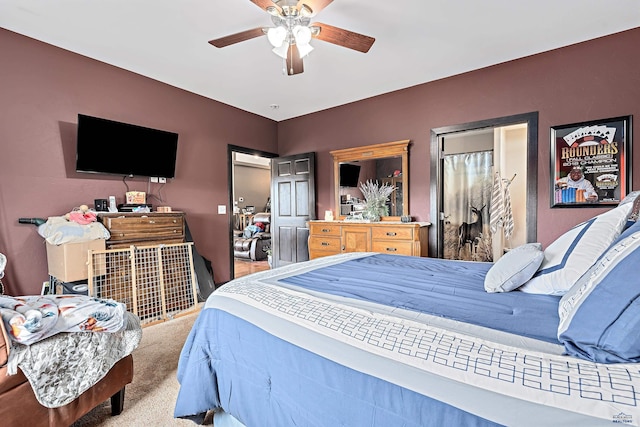 carpeted bedroom featuring ceiling fan