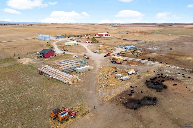 birds eye view of property with a rural view