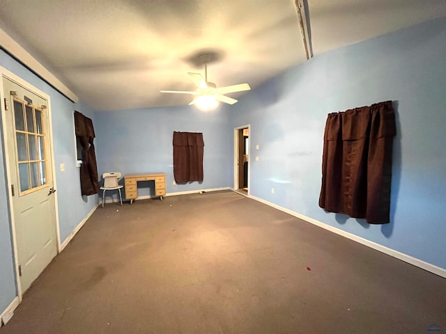 interior space featuring ceiling fan and lofted ceiling