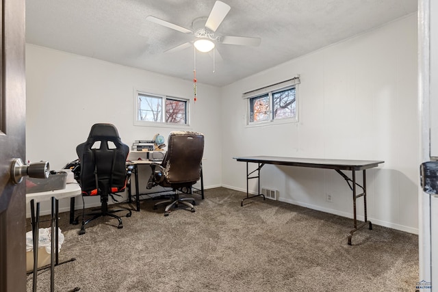 office area featuring carpet flooring, plenty of natural light, and ceiling fan