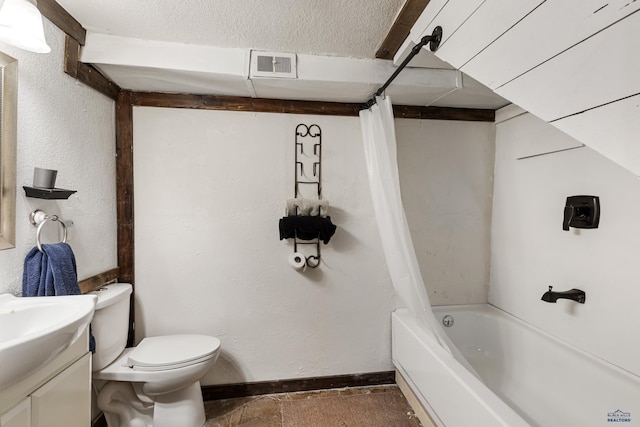 full bathroom featuring vanity, shower / bathtub combination with curtain, a textured ceiling, and toilet