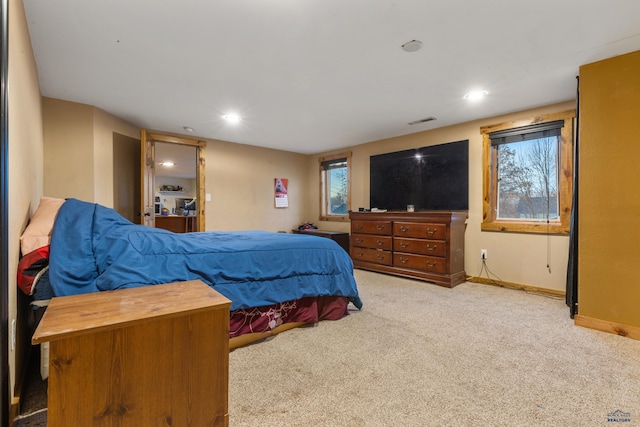 bedroom with light carpet