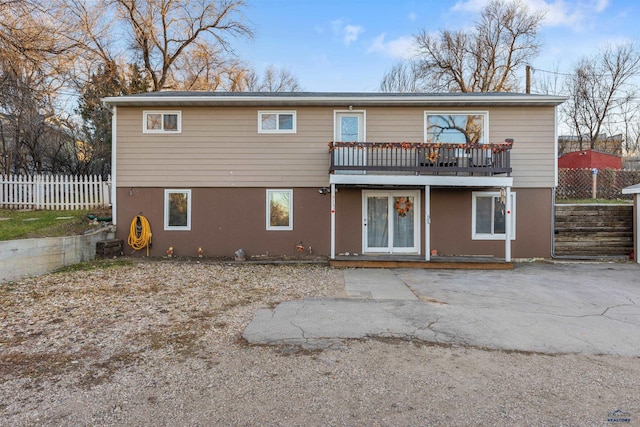 back of house with a patio and a wooden deck