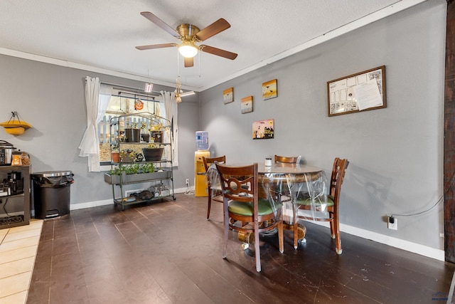 dining area with ceiling fan, crown molding, and a textured ceiling