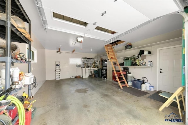 garage featuring a workshop area and a garage door opener