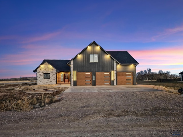 modern farmhouse featuring a garage