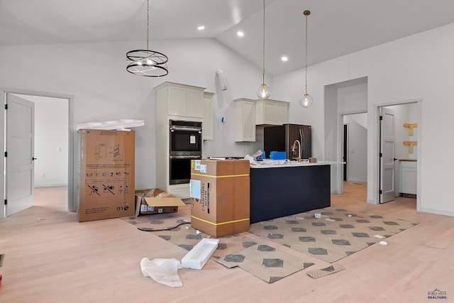 kitchen featuring decorative light fixtures, high vaulted ceiling, black double oven, and stainless steel refrigerator