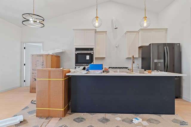 kitchen with light hardwood / wood-style flooring, pendant lighting, and lofted ceiling