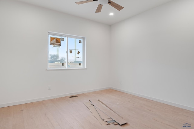 unfurnished room featuring ceiling fan and light hardwood / wood-style floors