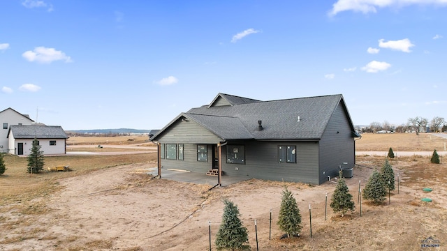 exterior space featuring a rural view and a patio area