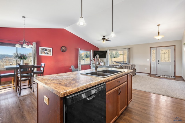 kitchen with dishwasher, sink, vaulted ceiling, dark hardwood / wood-style floors, and an island with sink