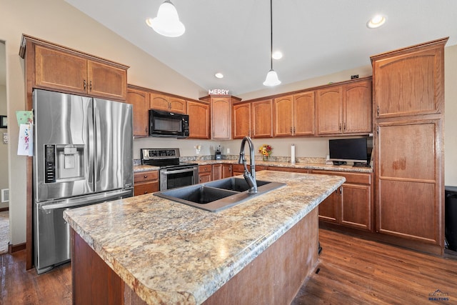 kitchen featuring appliances with stainless steel finishes, dark hardwood / wood-style floors, a kitchen island with sink, and pendant lighting