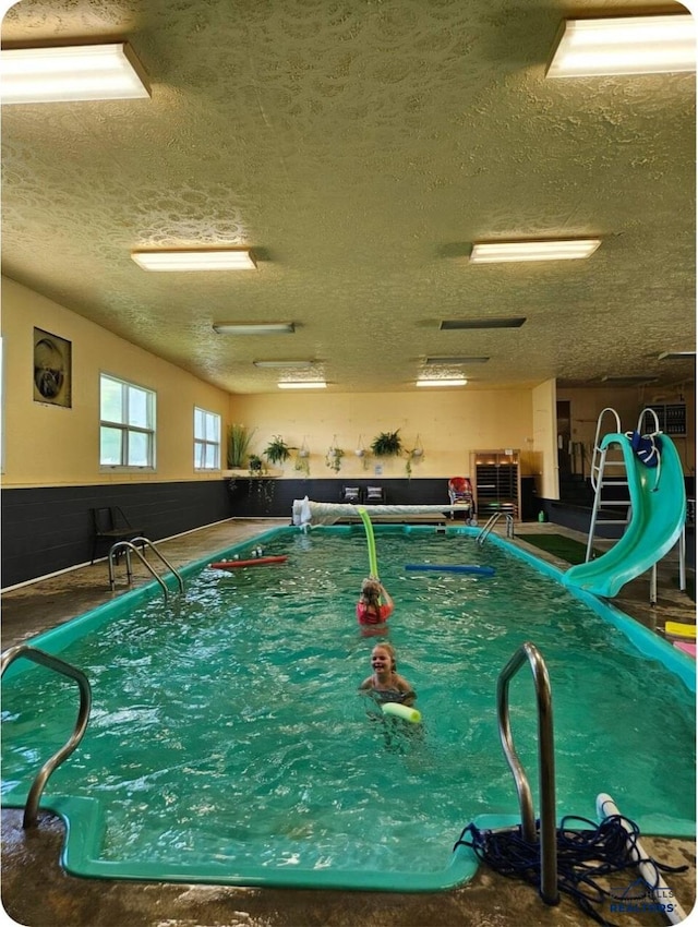 view of pool featuring a water slide