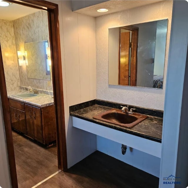 bathroom featuring vanity and hardwood / wood-style flooring