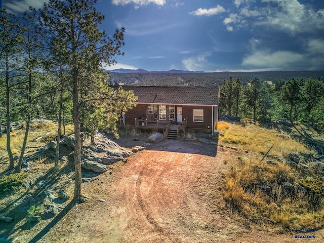 back of house featuring a mountain view