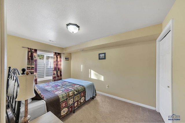 bedroom featuring a closet and carpet