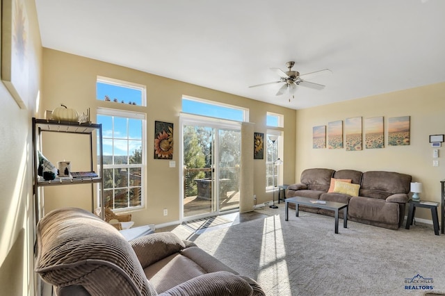 living room featuring ceiling fan and light carpet