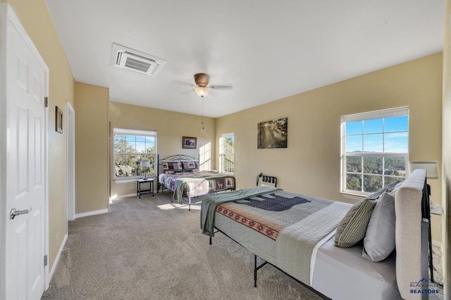 bedroom with light carpet and ceiling fan