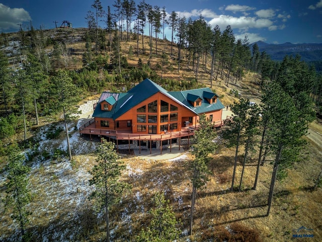 birds eye view of property with a mountain view