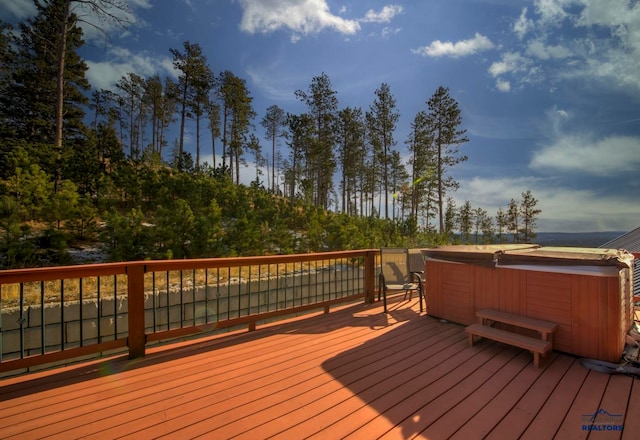 deck with a hot tub