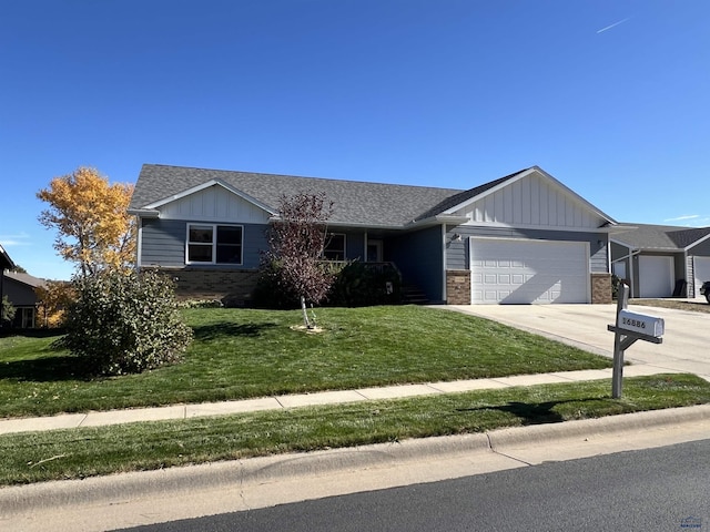 ranch-style house with a garage and a front lawn